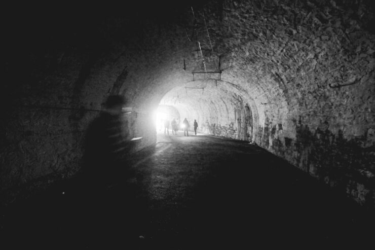 walking through a lagering cave, black and white image