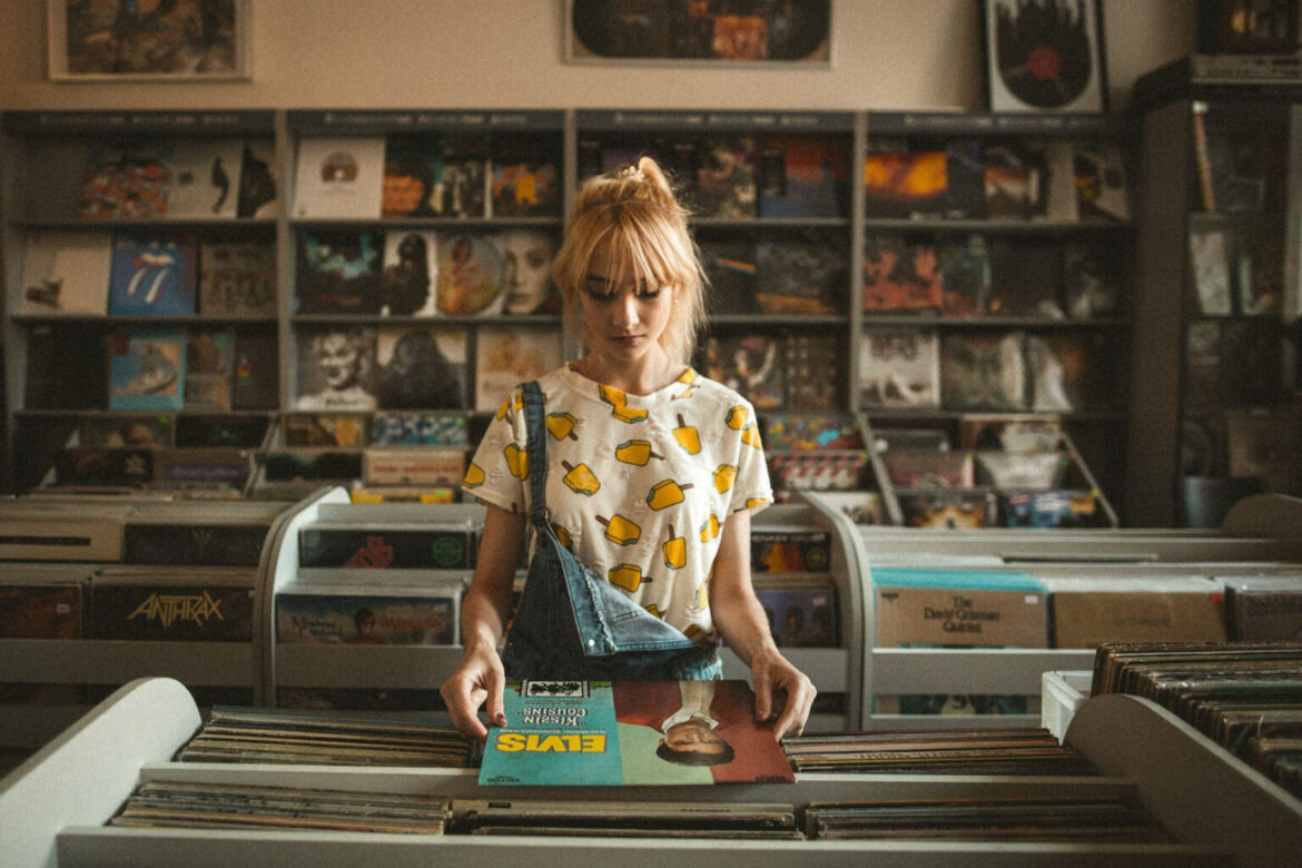 woman looking at record in a music store